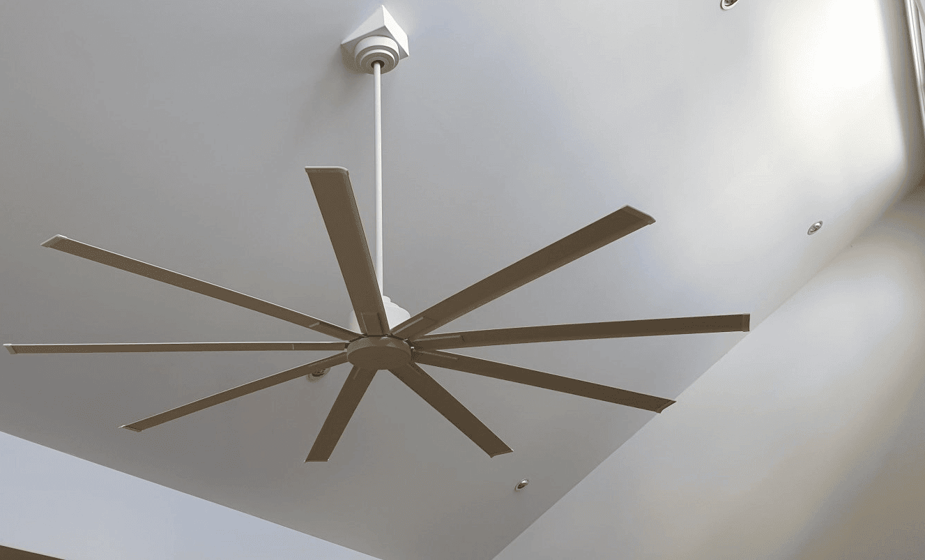 a ceiling fan install on a raked ceiling