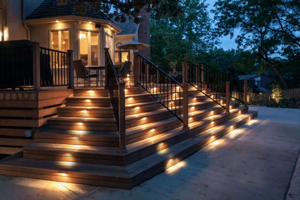 deck with lights on the stairs